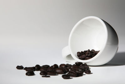 Close-up of coffee beans against white background