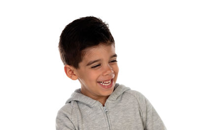 Portrait of happy boy against white background