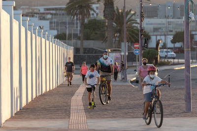 People riding bicycle in city