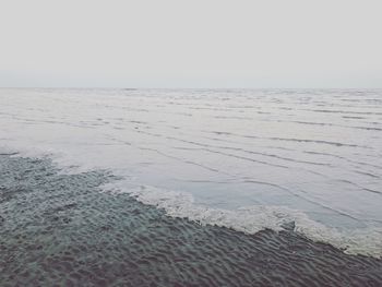 Scenic view of beach against clear sky