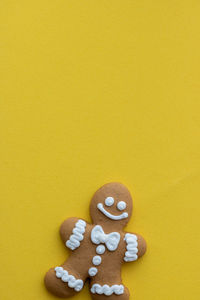 Directly above shot of cookies against yellow background