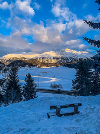 Scenic view of snow covered mountains against sky