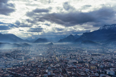 High angle view of city against cloudy sky