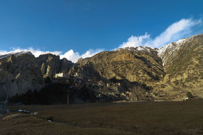 Scenic view of landscape and mountains against sky