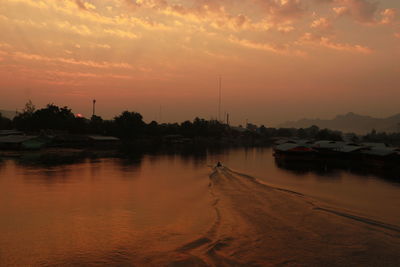 Scenic view of sea against orange sky