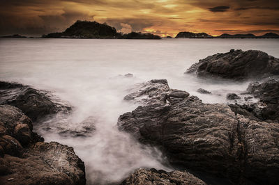 Scenic view of sea at sunset