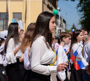 Group of people in traditional clothing standing outdoors