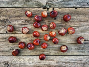 High angle view of chestnuts on wooden table