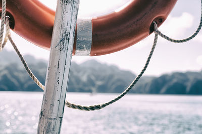 Close-up of chain against cloudy sky