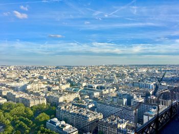 High angle view of buildings against blue sky