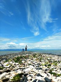 Scenic view of sea against blue sky