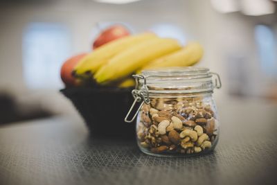 Close-up of fruits in jar on table