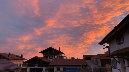 Low angle view of buildings against sky during sunset