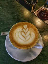 Close-up of cappuccino on table
