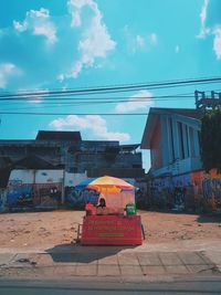 Street amidst buildings against sky