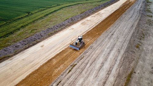 Aerial view of bulldozer on dirt road