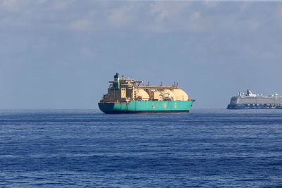 Ship in sea against sky