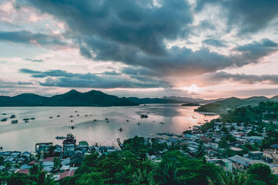 High angle view of bay and buildings against sky