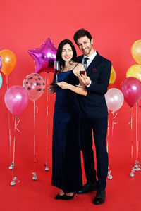 Two people with balloons