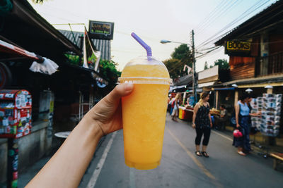 Close-up of hand holding drink