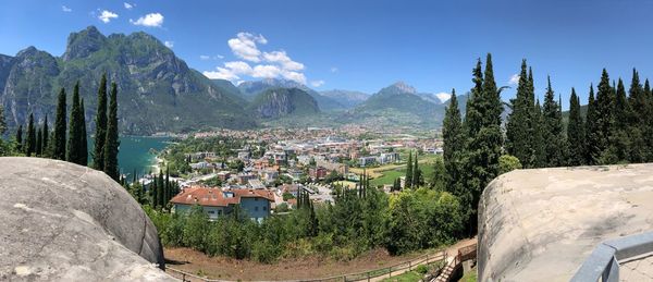 Panoramic view of townscape and mountains against sky