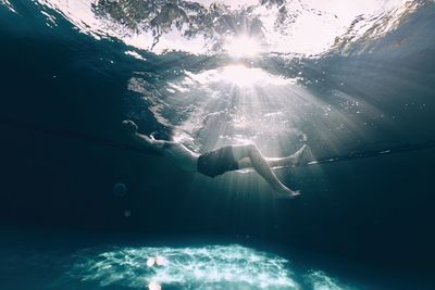 Woman swimming in sea