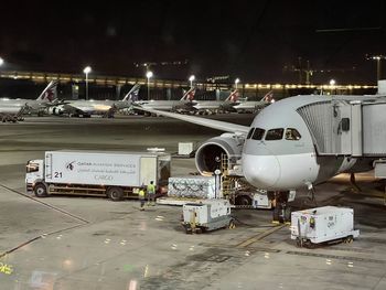 Airplane on airport runway at night