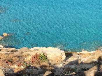 High angle view of rocks in sea