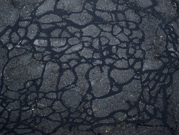 High angle view of cracked land on street