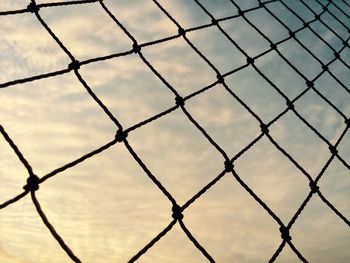 Full frame shot of chainlink fence against sky