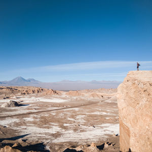 Standing on top of the moon valley in the atacama desert 