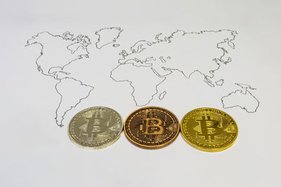 High angle view of coins on white background