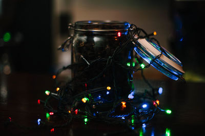 Close-up of illuminated christmas lights on table