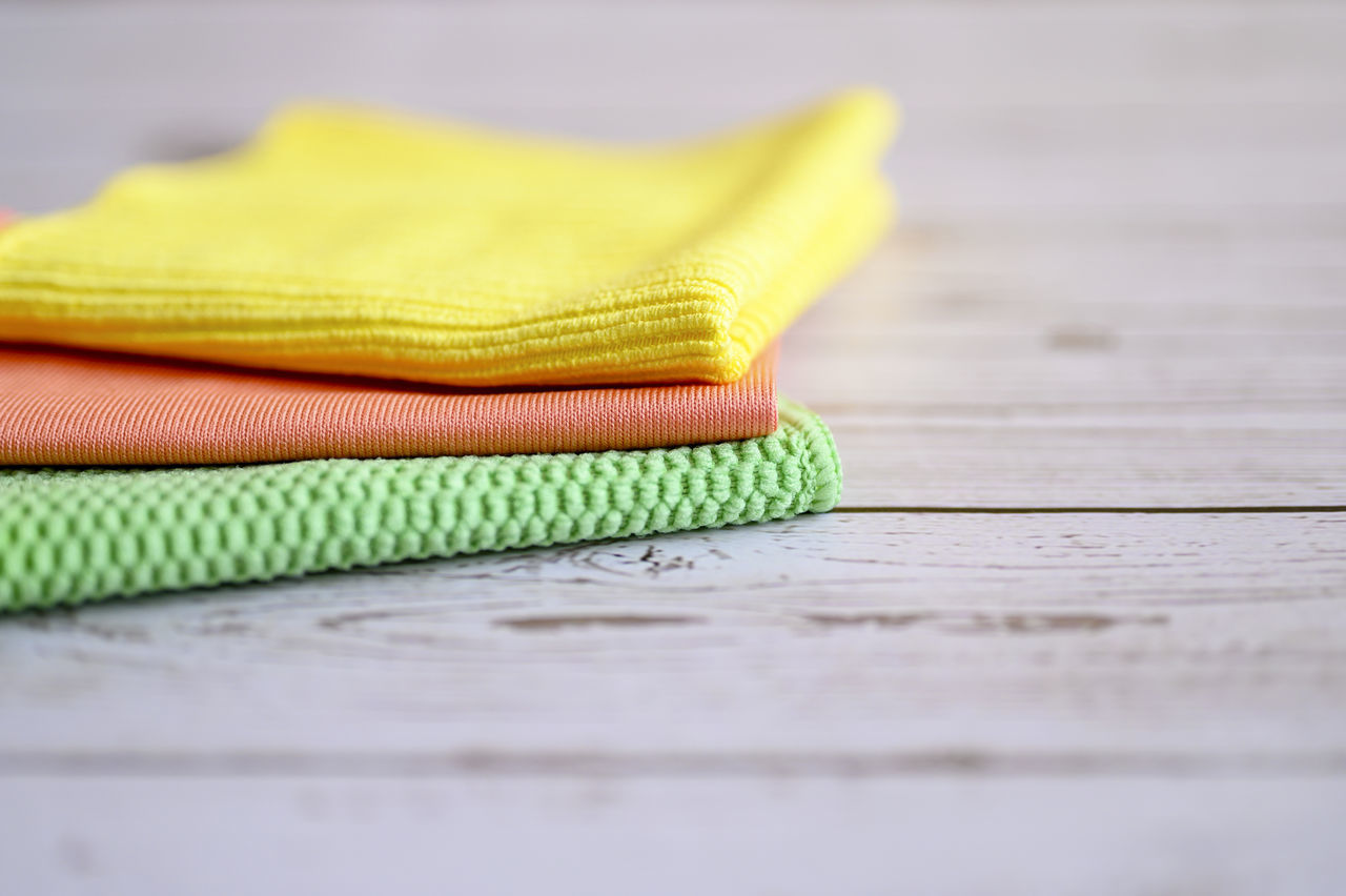 CLOSE-UP OF YELLOW TABLE ON FLOOR