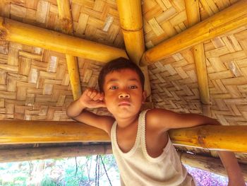 Portrait of boy in hut