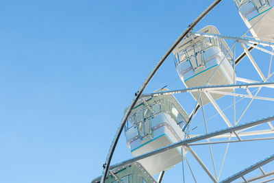 Low angle view of skyscraper against clear blue sky