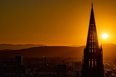 Silhouette of buildings at sunset