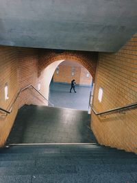Rear view of a man walking on corridor