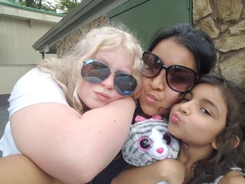 Portrait of mother and daughter outdoors