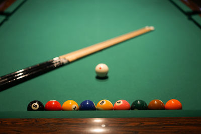 Cropped hand playing pool