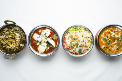 High angle view of food on table against white background