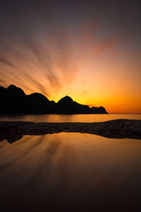 Scenic view of sea against romantic sky at sunset