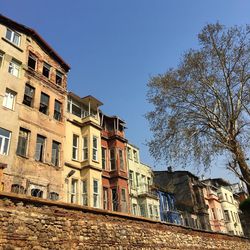 Low angle view of residential building against blue sky