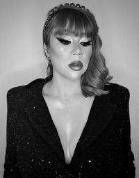 Portrait of a beautiful young woman over white background