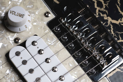 High angle view of guitar on table