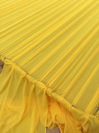 High angle view of tied up yellow textile