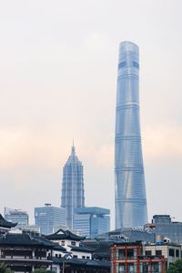 Modern buildings in city against sky