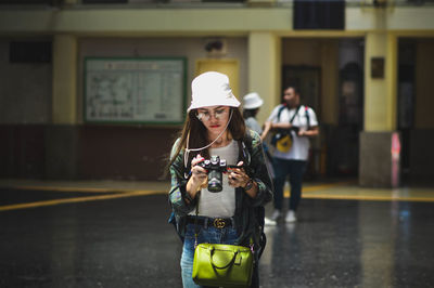 Man photographing in city