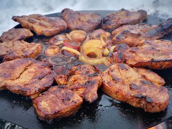 High angle view of meat on barbecue