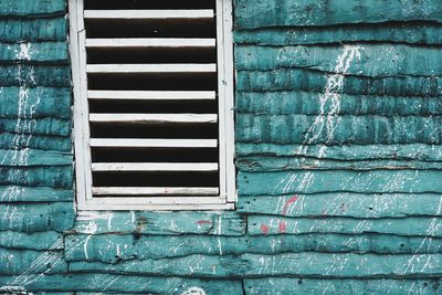 Close-up of window and palm wall in a batey in the dominican republic. 